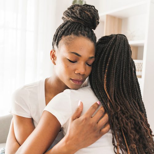 Mother and daughter hugging