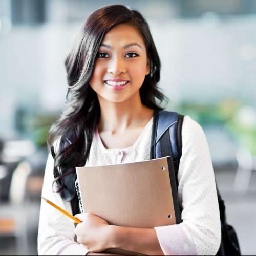 Student hold pad of paper